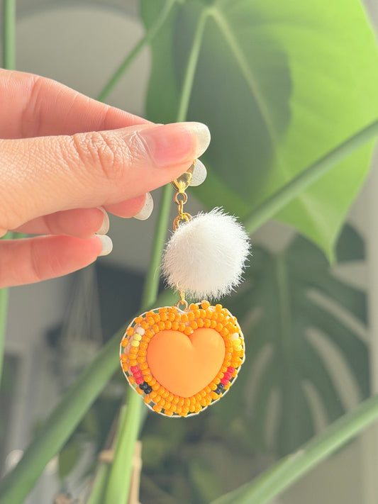 Orange heart pompom charm