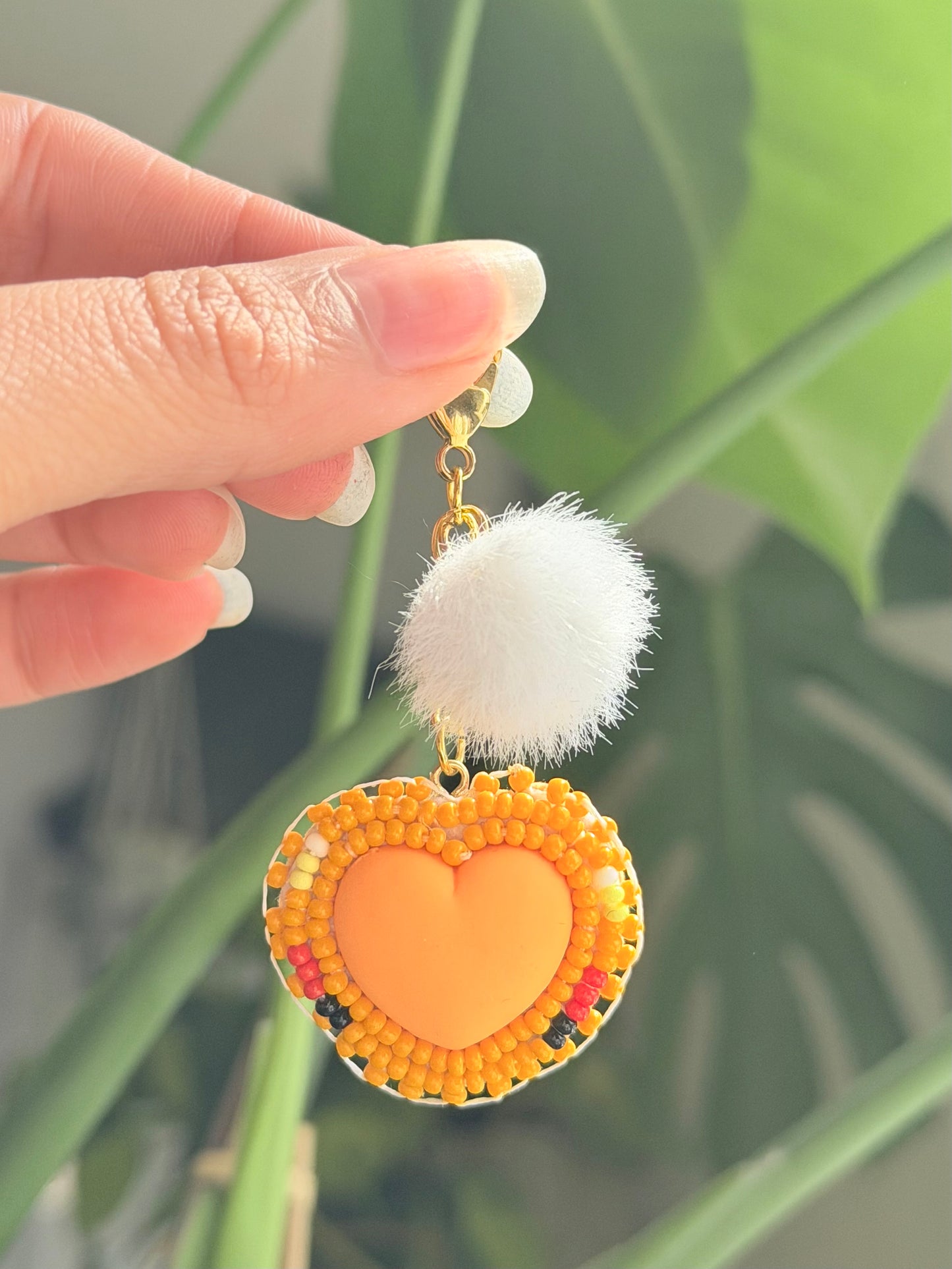 Orange heart pompom charm